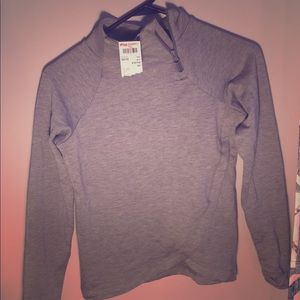 A grey sweat shirt with no hood